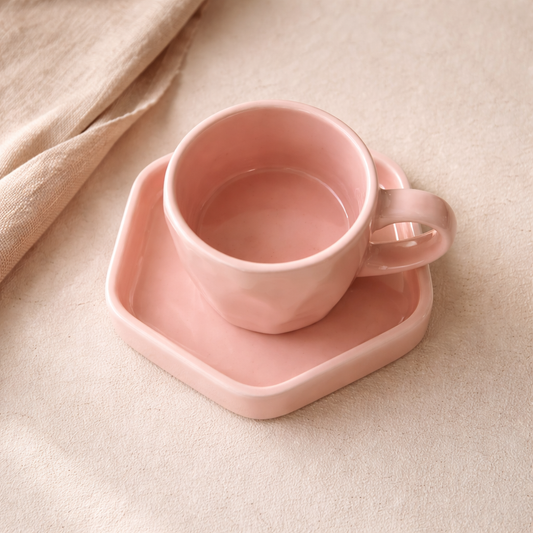 Close-up of soft pink glaze on a handcrafted ceramic coffee mug